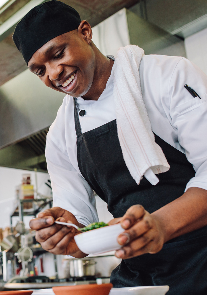 A picture of a chef preparing food